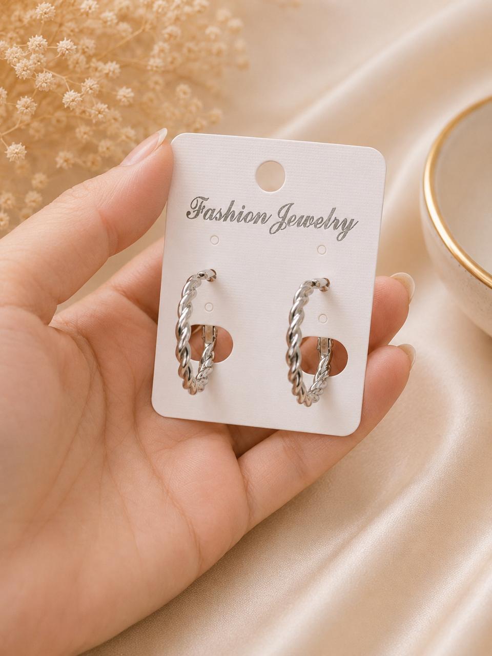 silver-tone hoop earrings أقراط حلقية بلون فضي